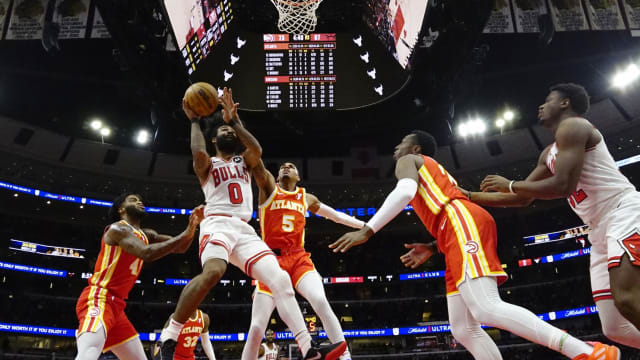 Atlanta Hawks guard Dejounte Murray (5) defends Chicago Bulls guard Coby White (0) during the second half at United Center.